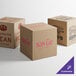 Three Lavex cardboard shipping boxes with customizable designs.