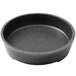 a black round pan with speckled surface