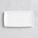 An American Metalcraft white rectangular melamine tray on a marble surface.