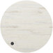 A white round BFM Seating melamine table top with a black wireless charger.