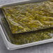 A tray of Atlantic Sea Farms Ready Cut Kelp Slaw on a gray surface.