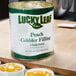 A can of Lucky Leaf Peach Cobbler filling on a table.