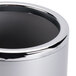 An American Metalcraft silver acrylic wine cooler on a table.