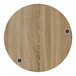 A BFM Seating round wood tabletop with two wireless chargers.