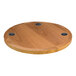 A BFM Seating round wooden table top with three wireless chargers.