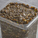 A container of Atlantic Sea Farms Kelp Seaweed Salad with a lid on a deli counter.