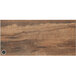 A knotty pine BFM Seating table top with a wireless charger.