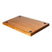 A BFM Seating rectangular wooden table top with black circles on it.