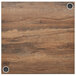 a wood surface with metal screws