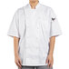 A woman wearing a white Uncommon Chef Aruba Pro Vent chef coat.