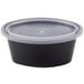 A Pactiv Newspring black oval souffle container with a clear lid.