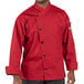 A man wearing a Uncommon Chef red long sleeve chef coat.