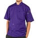 A man wearing a purple Uncommon Chef South Beach short sleeve chef coat.