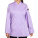 A woman wearing a lilac Uncommon Chef long sleeve chef coat.