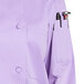 A close-up of a Uncommon Chef Tempest Pro Vent long sleeve chef coat in purple with a mesh back.