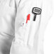 a person wearing a white coat with a pen and a tonometer in the pocket