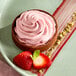 A dessert in a bowl with Fabbri Delipaste strawberry flavoring.