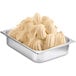 A metal container with white Fabbri Morbifrutta gelato base inside.
