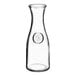 A clear glass Anchor Hocking carafe with a round neck.