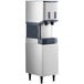 A Scotsman air cooled ice machine with water and ice dispensers on an enclosed stand.