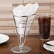 An American Metalcraft stainless steel cone basket holding a white napkin.