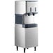 A Scotsman stainless steel ice machine with a cooler and two cups of nugget ice.