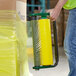 A man using a Lavex Coreless Stretch Wrap Dispenser to wrap pallets.