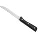 A Choice jumbo steak knife with a black handle.