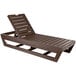 A brown wooden chaise lounge.