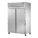 A True commercial combination refrigerator and freezer with two silver doors.