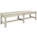 a white bench with a cross leg