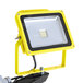 A yellow Lind Equipment LED dual head floodlight on a black tripod.