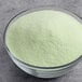 A bowl of DOLE Soft Serve Lime powdered mix.