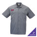 A gray short sleeve work shirt with two chest pockets and a customizable name patch on the left side.