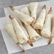 A group of Handy Crispy Shrimp Wraps on a white surface.