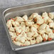 A tray of Handy Colossal Lump crab meat on a hotel buffet counter.