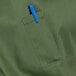 A blue pen in the pocket of a green apron with black webbing.