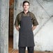 a close-up of a person wearing a striped apron