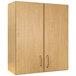 A Tot Mate maple laminate wall cabinet with two silver handles.