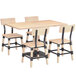 A Lancaster Table & Seating solid wood live edge table and chairs with a white wash finish.