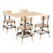 A Lancaster Table & Seating solid wood table with a bleached oak finish and live edge with black metal chairs.
