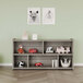 A Tot Mate Shadow Elm laminate toddler compartment storage unit with toys on the shelves.