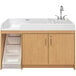 A maple Tot Mate toddler walkup changing table with a right side sink and storage.