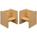 A beige and maple laminate activity cube with a wood surface and a shelf.