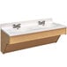 A Tot Mate double maple laminate wall vanity with white sinks and silver faucets.
