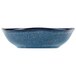 A Tuxton TuxTrendz Artisan Night Sky fruit dish with a wavy rim in blue.