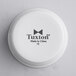 A Tuxton white porcelain ramekin with black text.