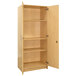 A Tot Mate maple tall cabinet with two doors open.