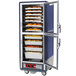 A blue Metro C5 heated holding cabinet with clear Dutch doors holding food.