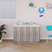 A Tot Mate shadow elm laminate floor vanity in a bathroom with a window.